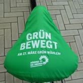 Fahrrad-Sattelschutz gr&uuml;n 1farbig wei&szlig; bedruckt